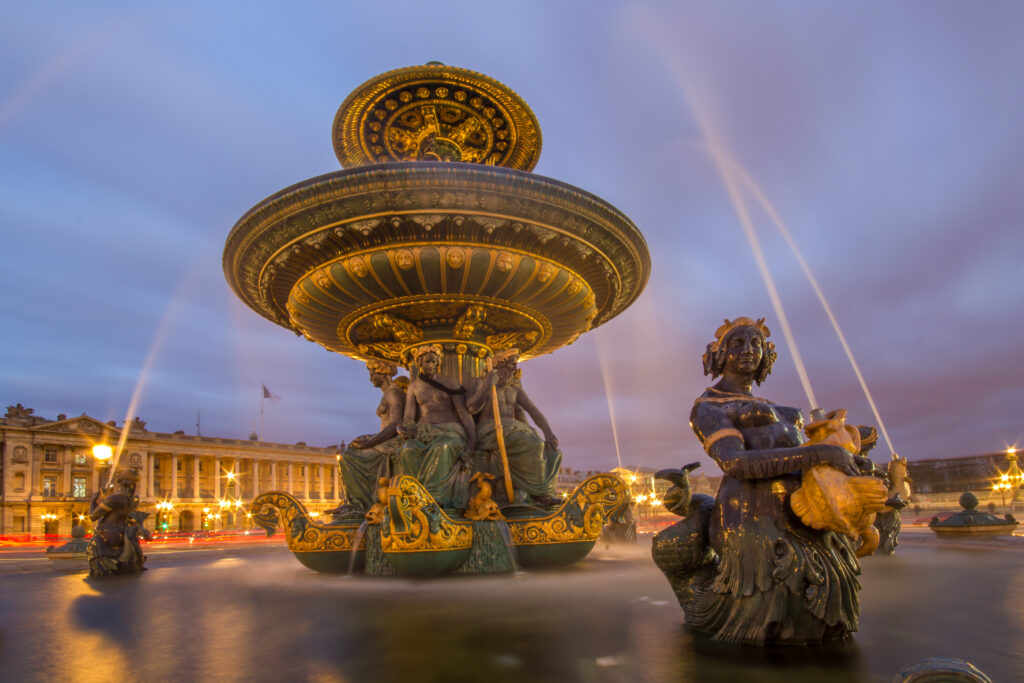 Close up of the water flowing in a fountain at the Place de la Concorde in Paris.